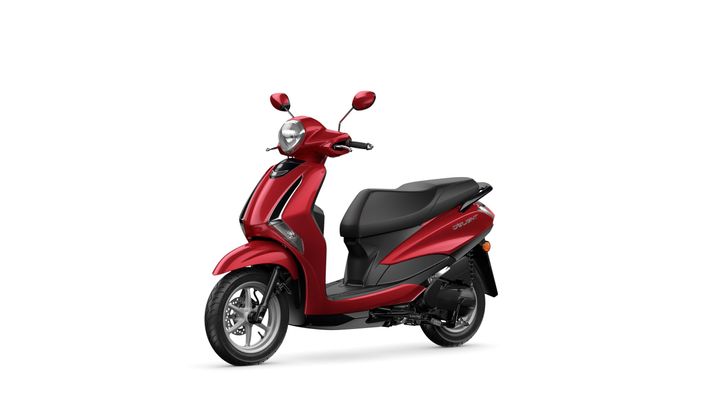 A sleek red scooter with a stylish design, featuring a comfortable seat, a round headlight, and dual rearview mirrors, positioned on a white background.