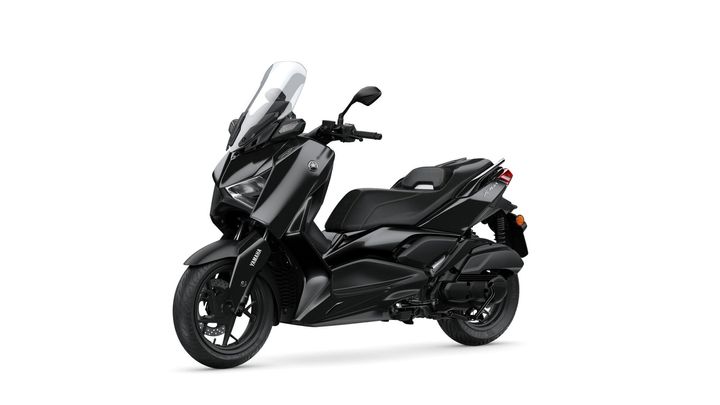 A sleek, black Yamaha scooter angled to the right, showcasing its modern design, with a tall windshield and a sporty seat.