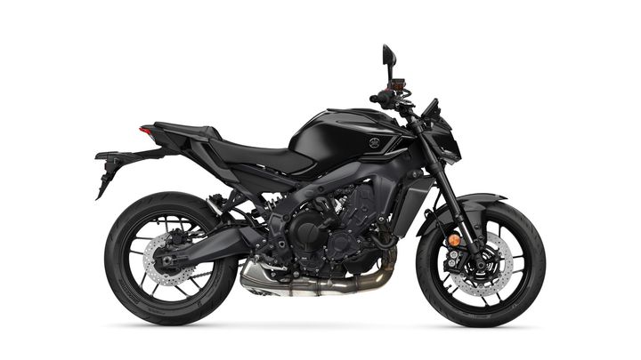 A sleek black motorcycle with a modern design, showcasing a side view that highlights its engine, wheels, and minimalistic bodywork.