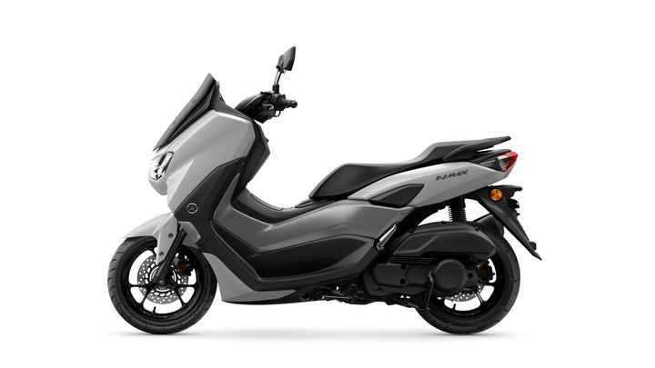 A sleek gray scooter with a modern design, featuring a streamlined body, comfortable seat, and prominent headlights, displayed in profile against a white background.