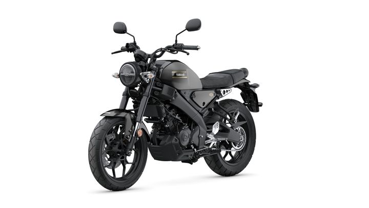 A Yamaha motorcycle with a sleek design, featuring a matte gray body, round headlight, and black seat, positioned at a slight angle with a white background.