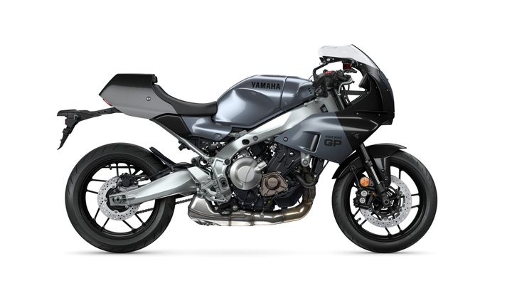A sleek Yamaha XSR900 GP motorcycle in a two-tone gray and black finish, featuring a modern design with a windscreen, sporty seating, and prominent exhaust pipes.