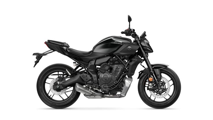 A sleek black Yamaha MT-07 motorcycle captured from the side, showcasing its modern design, prominent engine, and sporty features.