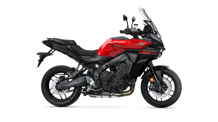 A sleek, red and black Yamaha motorcycle positioned on a white background, showcasing its sporty design, prominent engine, and detailed wheel features.