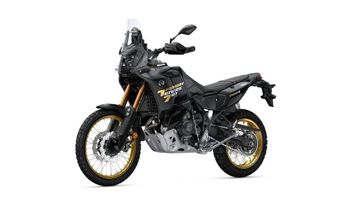A black Yamaha Tenere 700 adventure motorcycle with gold accents, featuring a rugged design, an upright riding position, and off-road tires, positioned on a white background.