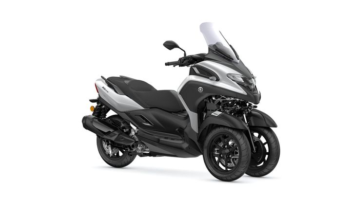 Yamaha 2025 Tricity 300 A sleek, modern two-wheeled scooter featuring a stylish silver and black design, showcasing a windshield, comfortable seat, and distinctive dual front wheels.