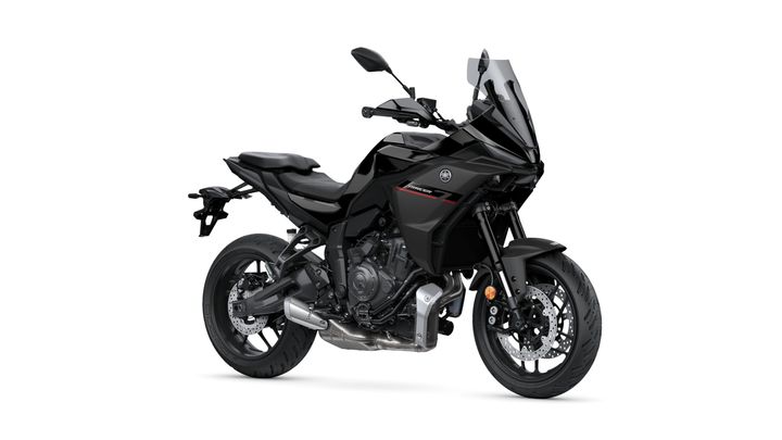 A sleek black motorcycle with a modern design, featuring a prominent front fairing, dual headlights, and a sporty frame, positioned at a slight angle.