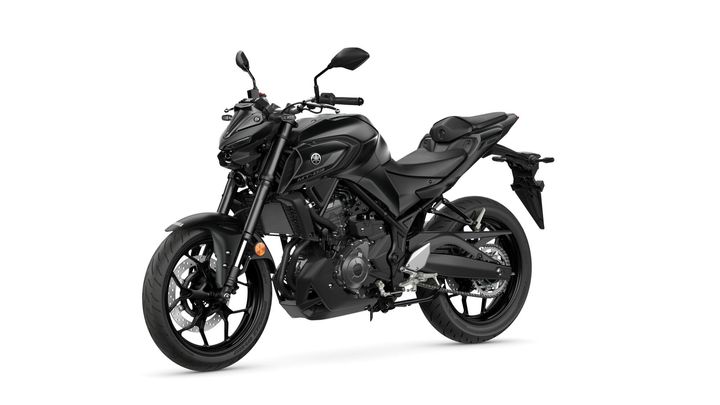 A black Yamaha MT-03 motorcycle positioned at an angle, showcasing its sleek design, handlebars, and modern features against a white background.