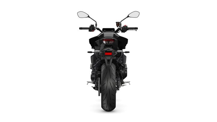 A rear view of a sleek black motorcycle with a wide tire, rear lights, and handlebars equipped with controls and mirrors, set against a white background.