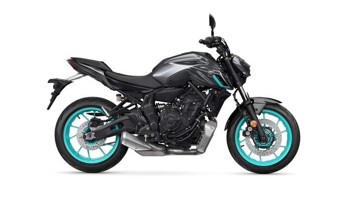 A modern motorcycle featuring a sleek gray body with turquoise accents on the wheels and design elements, displayed side-on against a white background.