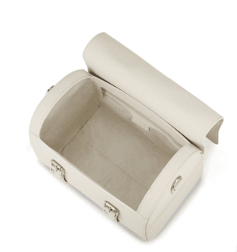 An open beige jewelry box with a rounded lid, interior compartments, and metal clasps, on a white background.