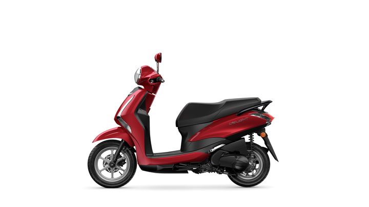 A red scooter with a sleek design, featuring a black seat, visible wheels, and a rearview mirror, positioned against a white background.