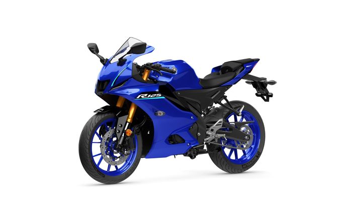 A blue sport motorcycle with a sleek design, featuring a fairing, a windscreen, and distinctive blue wheels. The model designation "R125" is displayed on the side.