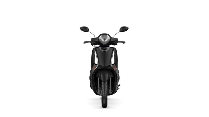 A sleek black scooter, seen from the front, featuring a streamlined design, distinct headlights, and prominent rearview mirrors.