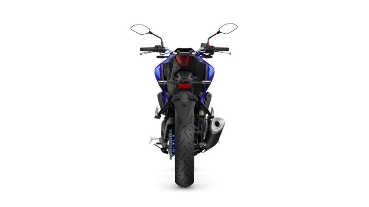 A rear view of a blue motorcycle showcasing the handlebars, tail light, and rear tire on a white background.