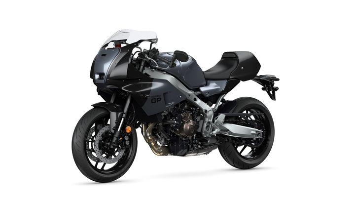 A sleek, modern motorcycle with a grey and black design, featuring a sporty fairing, curved windshield, and dual disc brakes on the front wheel.