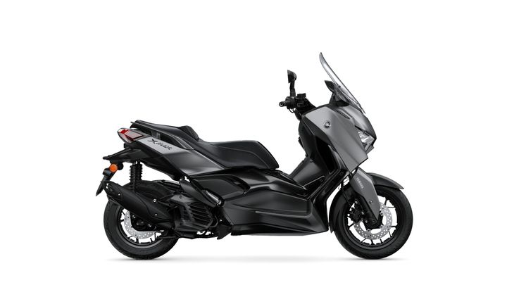 A sleek black Yamaha XMAX scooter viewed from the side, showcasing its modern design, large windshield, and sporty details.