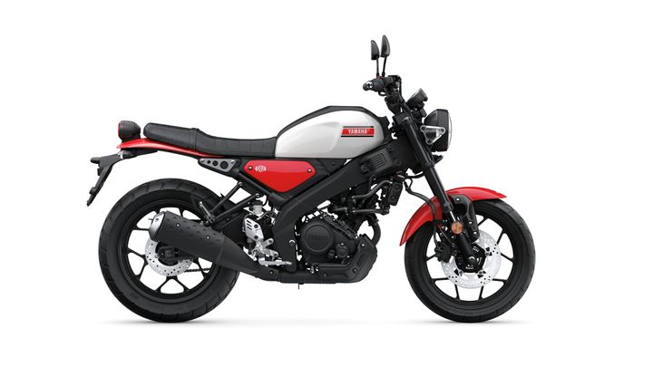 A sleek, modern motorcycle featuring a black and red color scheme, with a minimalist design, a low seating position, and a classic look. The bike is positioned against a plain white background.