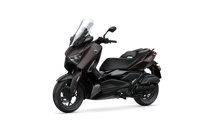A sleek, dark brown Yamaha XMAX scooter is displayed at an angle, showcasing its modern design, large windshield, and comfortable seating.