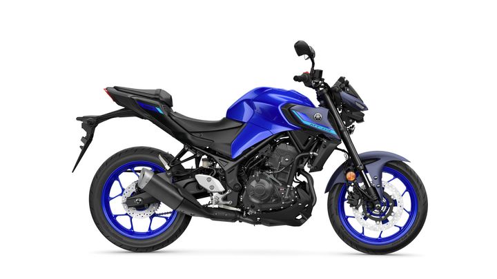 A side view of a blue Yamaha MT-03 motorcycle, showcasing its sleek design with black accents, a sporty frame, and distinctive blue rims.