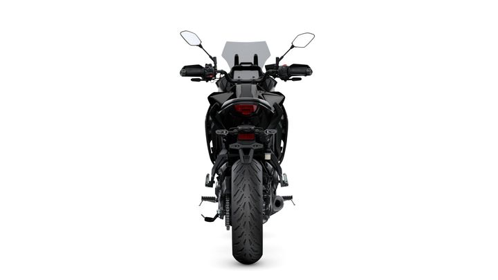 A rear view of a black motorcycle featuring a prominent tail, distinctive tire tread, and dual side mirrors. The motorcycle is showcased against a plain white background.