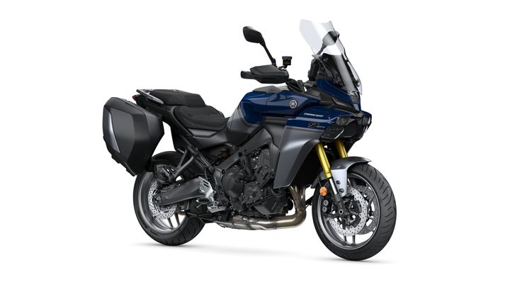 Yamaha 2025 TRACER 9 GT+ Y-AMT A blue Yamaha motorcycle, model Tracer 9 GT, featuring a sleek design, a tall windshield, and a single side case. The bike is positioned on a white background, showcasing its modern aesthetic and dual front headlights.