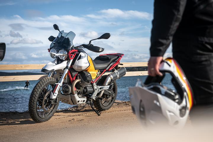 Left facing Moto Guzzi V85-TT by the beach