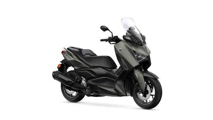 A sleek, modern scooter with a matte green and black design, featuring a windscreen, comfortable seat, and sporty profile, positioned on a white background.