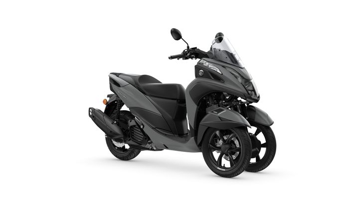 Yamaha 2024 Tricity 125 A sleek gray three-wheeled scooter with a modern design, featuring a streamlined body, a windshield, and a comfortable seat.