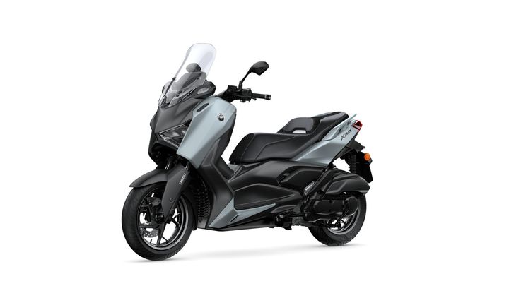 A sleek gray and black scooter with a windshield, showcasing its modern design and features.