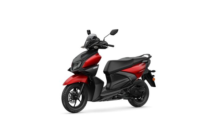 A stylish red and black scooter with a modern design, featuring a prominent front headlight, large wheels, and a comfortable seat.