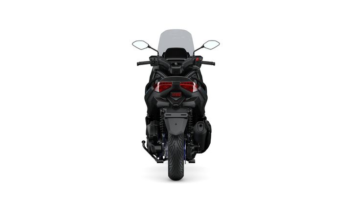 A sleek black motorcycle viewed from the rear, featuring a transparent windscreen, dual rear lights, and a thick rear tire, set against a plain white background.