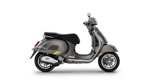 A sleek, modern gray scooter with green accents, viewed from the side, showcasing its design, wheels, and handlebars.