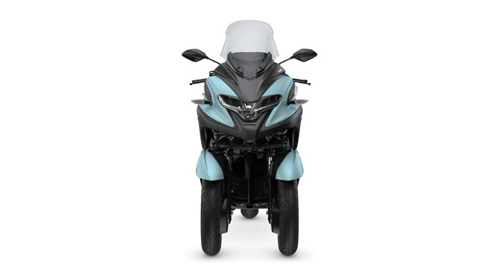 A front view of a two-wheeled motorcycle, featuring a sleek design with a black and aqua color scheme and a clear windshield.