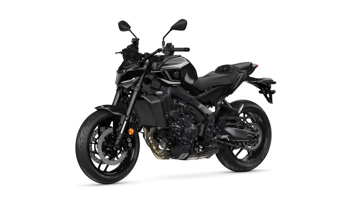 A sleek black motorcycle with a modern design, featuring a prominent front wheel, aggressive styling, and a minimalist seat, set against a white background.