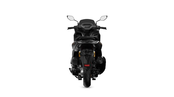 A sleek black motorcycle viewed from the rear, showcasing its detailed components, including the rear wheel, exhaust, and handlebars, against a plain white background.