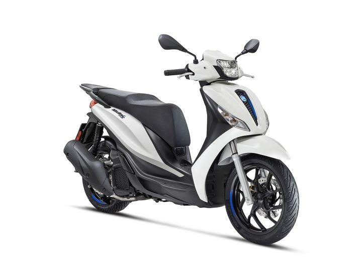 A white scooter with a black seat and blue accents, facing slightly to the right, showcasing its front and side profile.