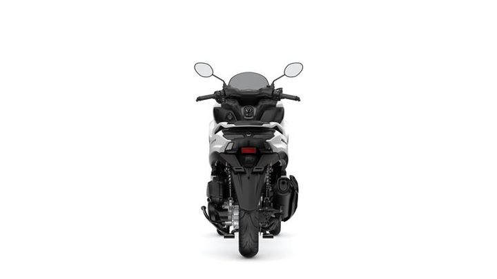 A rear view of a modern motorcycle, showcasing its sleek design, dual mirrors, and rear lights against a white background.