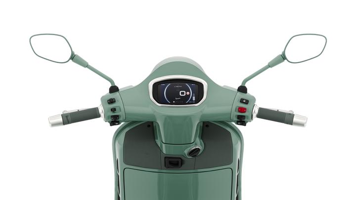 Image of a scooter's handlebars, featuring a rounded display screen, control buttons, and mirrors, all in a mint green color scheme.
