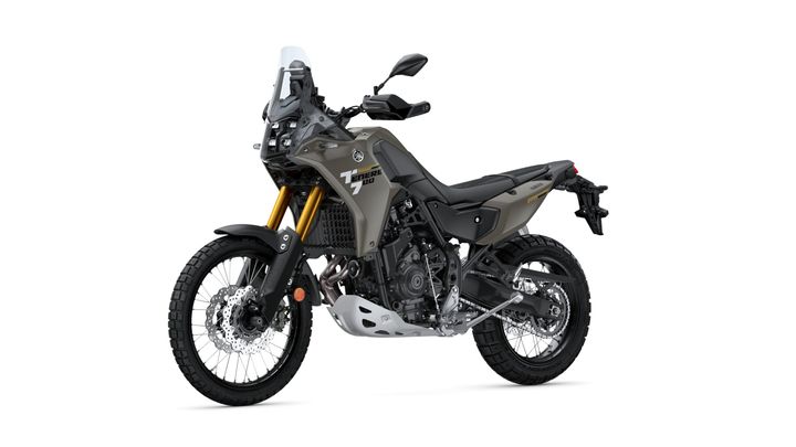 Yamaha Ténéré 700 adventure motorcycle in a gray color scheme, featuring off-road tires, a prominent front fender, and a tall windscreen, positioned against a white background.