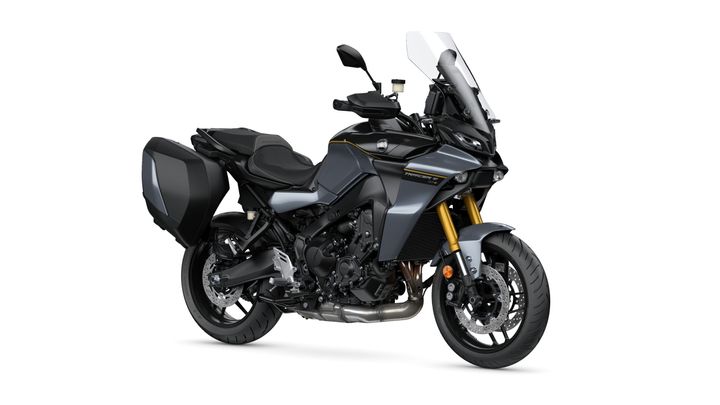 Yamaha 2024 Tracer 9 GT+ A sleek, gray adventure motorcycle with a prominent windshield, gold suspension, and saddlebags, positioned on a white background.