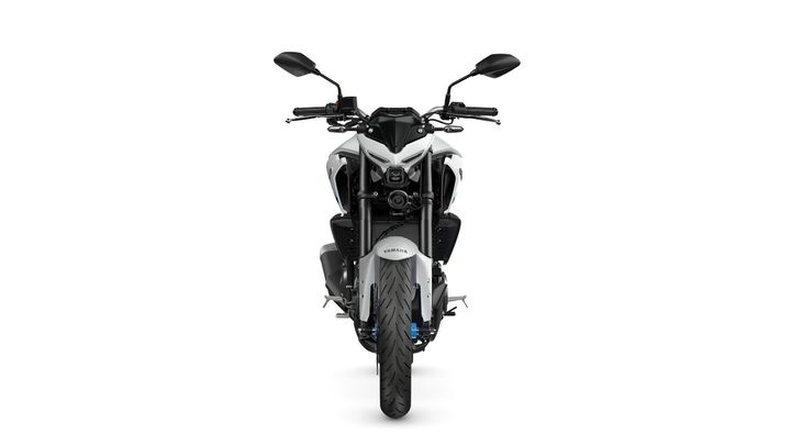 Front view of a Yamaha motorcycle showcasing its sleek design, handlebars, and tire on a white background.