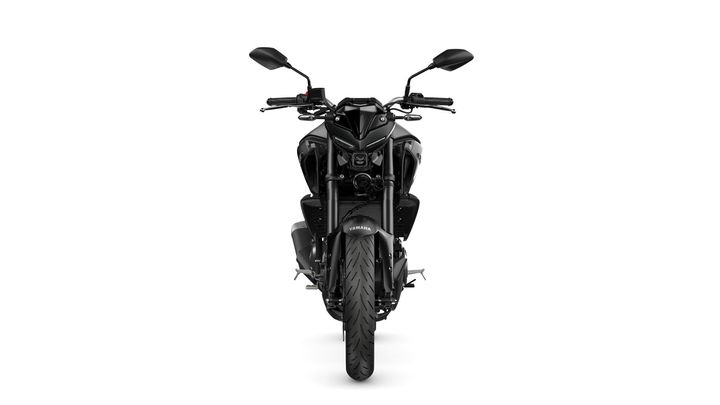 A front view of a black Yamaha motorcycle, showcasing its sleek design, handlebars, and large front tire against a white background.