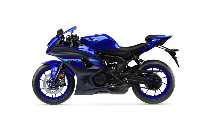 A sleek blue motorcycle with a modern design, featuring a low seat, aerodynamic bodywork, and sport-style wheels, positioned against a white background.