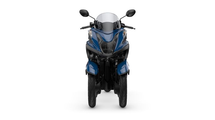 A blue three-wheeled motorcycle viewed from the front, featuring a sleek design with a windshield, dual headlights, and handlebars. The tires are prominently displayed at the bottom.