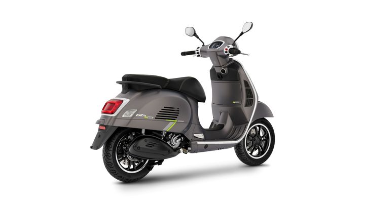 A sleek, modern gray scooter with a black seat, featuring stylish black wheels and a subtle green accent along the side.