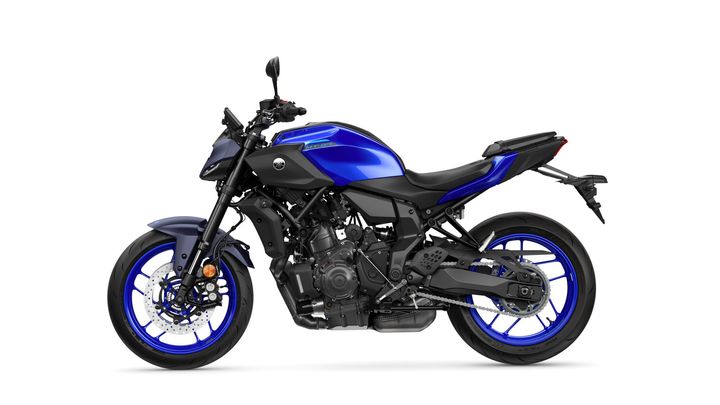 A blue and black Yamaha MT-07 motorcycle viewed from the side, showcasing its sporty design and modern styling.