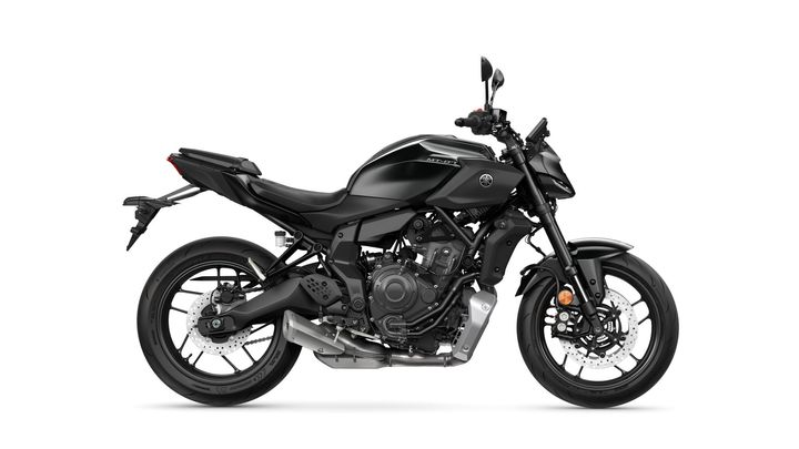 A side view of a sleek black motorcycle with modern design features, showcasing a minimalist frame and powerful engine components.