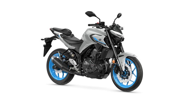 Yamaha 2025 MT-03 A sleek, modern motorcycle with a silver and black body, blue wheels, and sporty design elements, positioned against a white background.