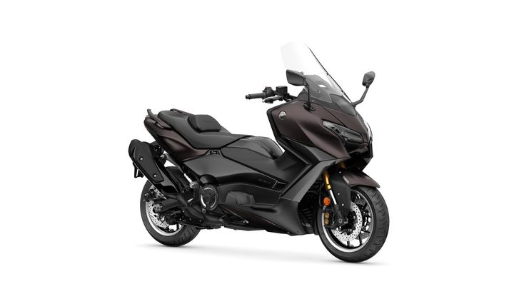 A sleek black and brown touring motorcycle, featuring a large windshield, comfortable seat, and modern design, positioned on a white background.